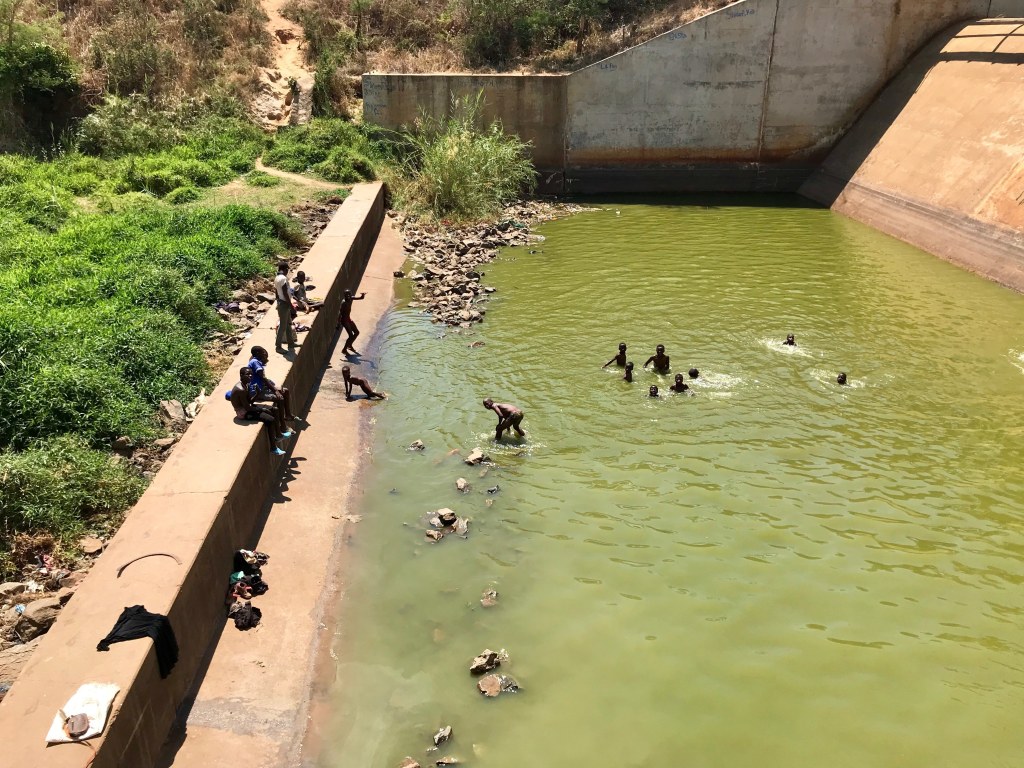 Children swim because they were turned away from school for arriving late.